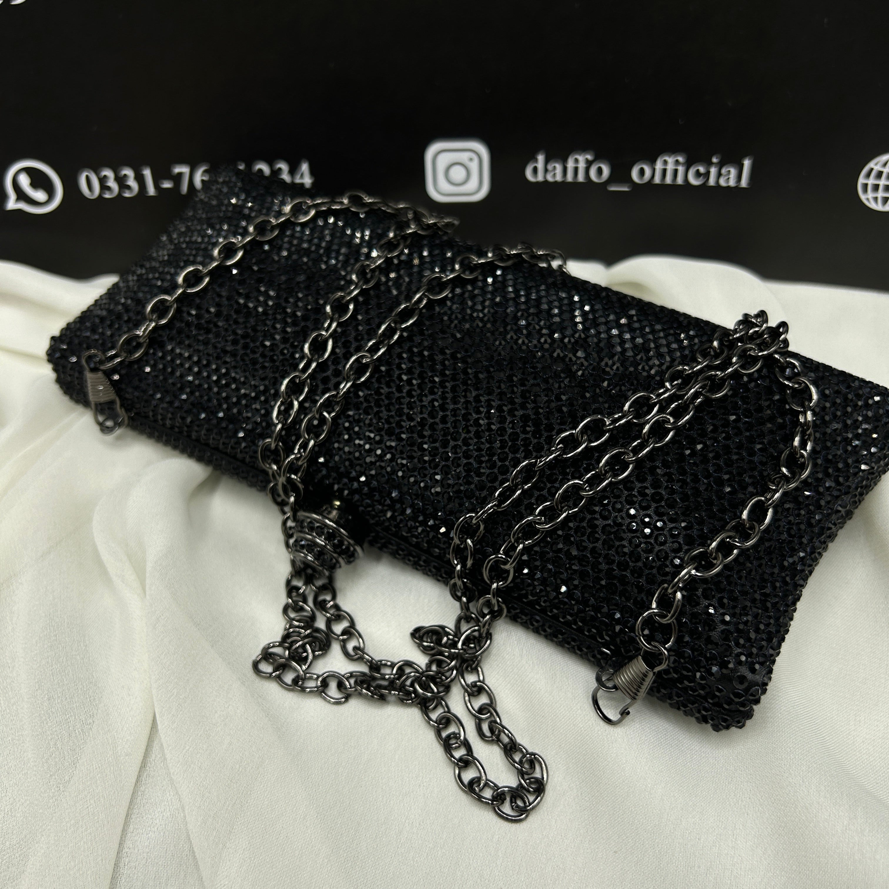 Ladies clutch with swarovski crystals all around 