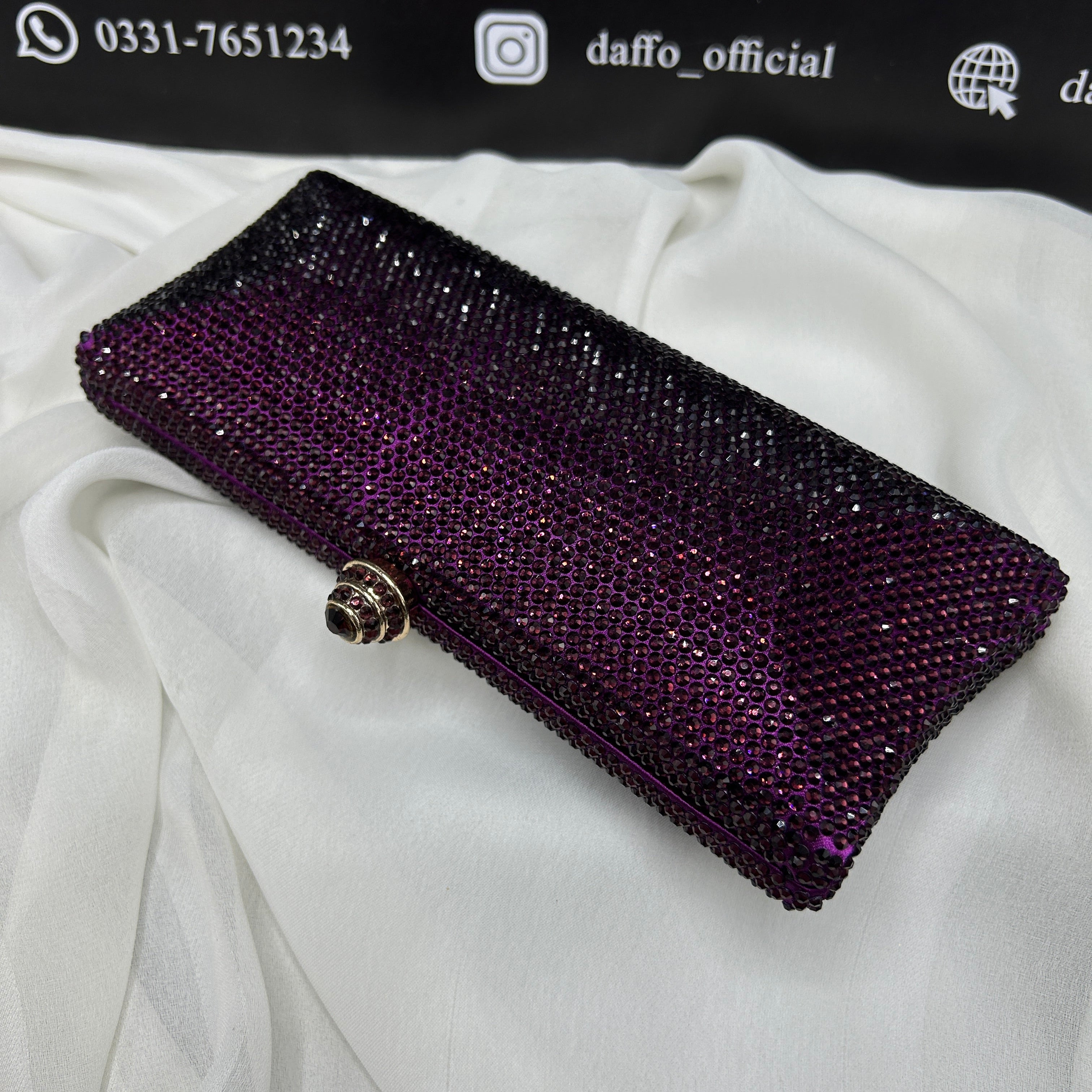 Ladies clutch with swarovski crystals all around 